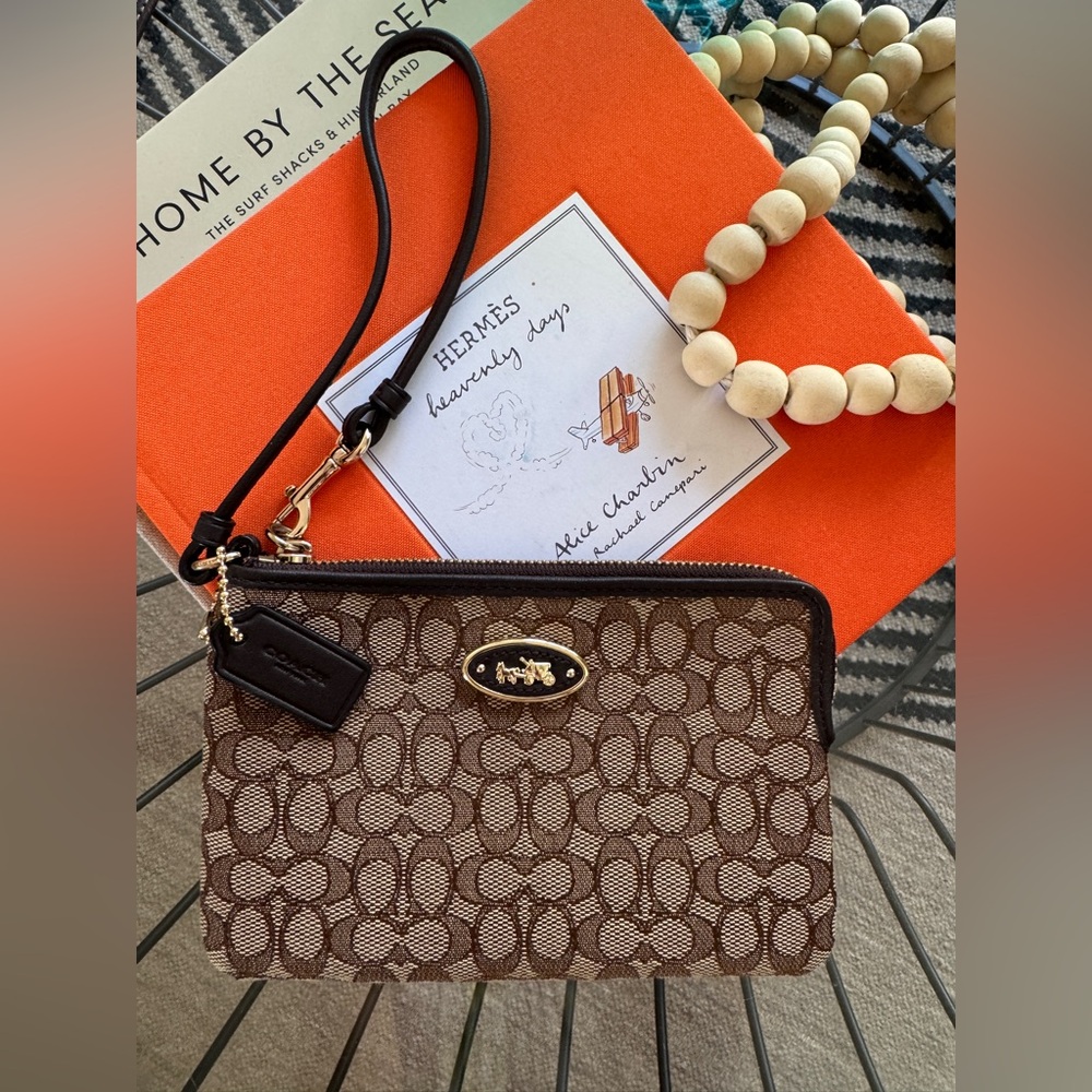 NEW COACH Tan and Brown Jacquard Wristlet. Gold Hardware. Never worn.